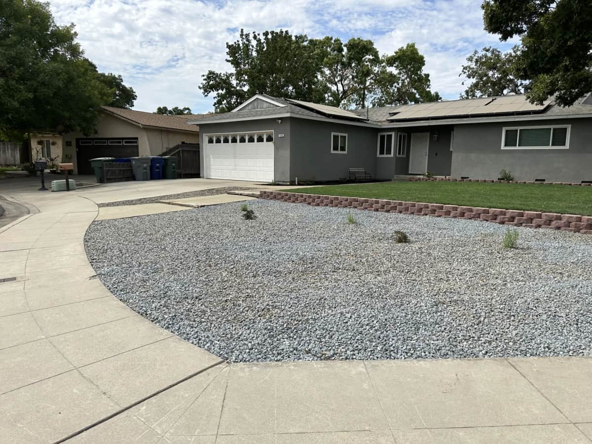 Front yard retaining wall with crushed rock