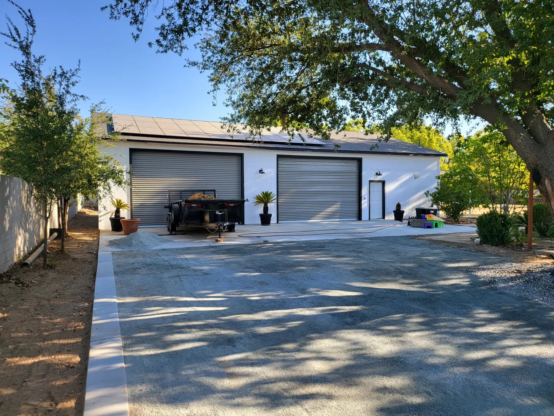 DG driveway near garage — closeup