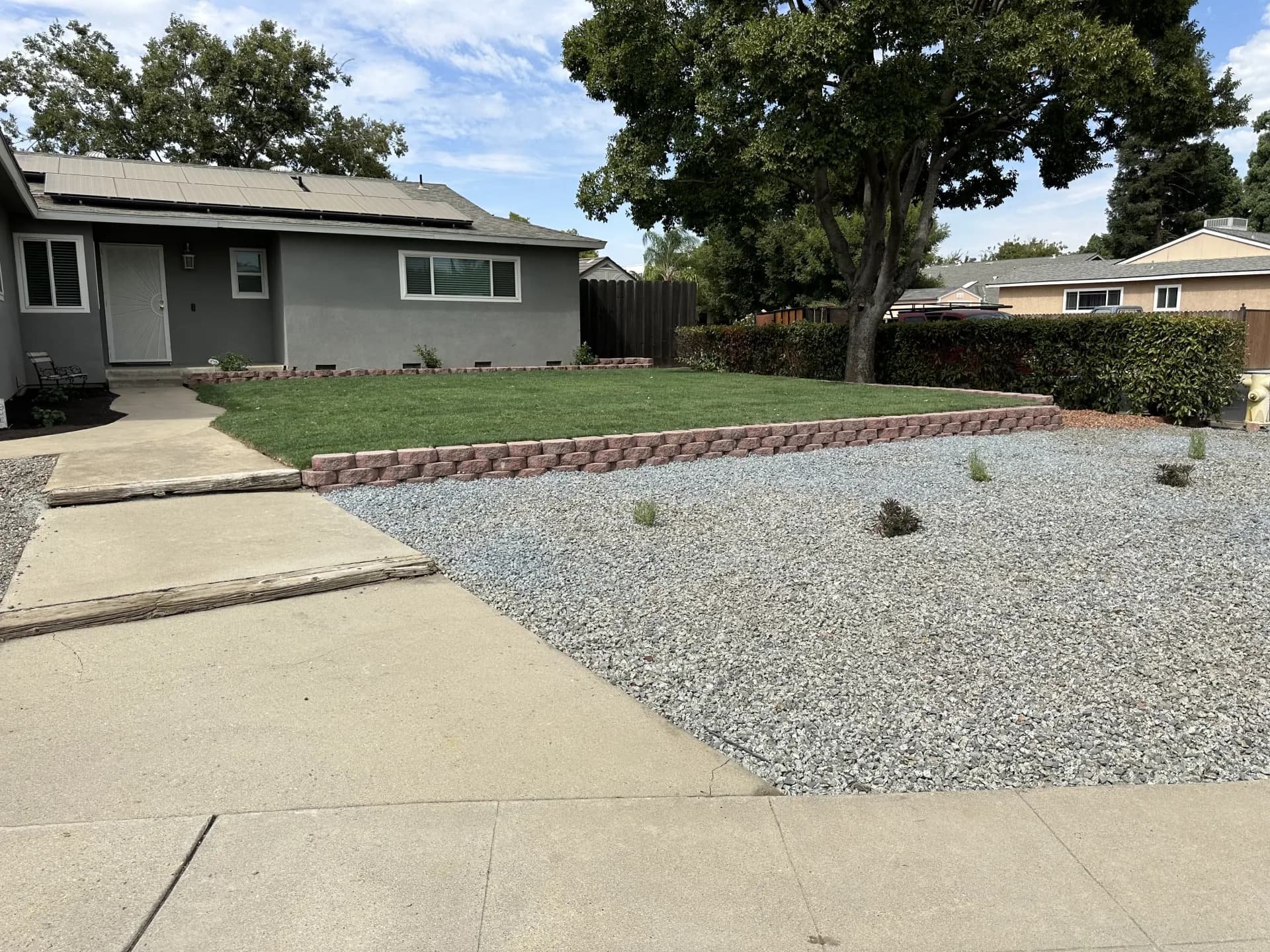 Front yard lawn elevated over rock border