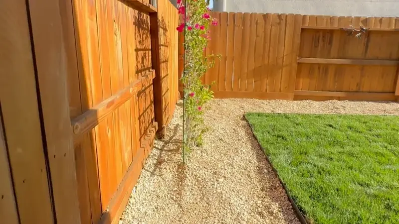 Rock backyard with sod and gravel border