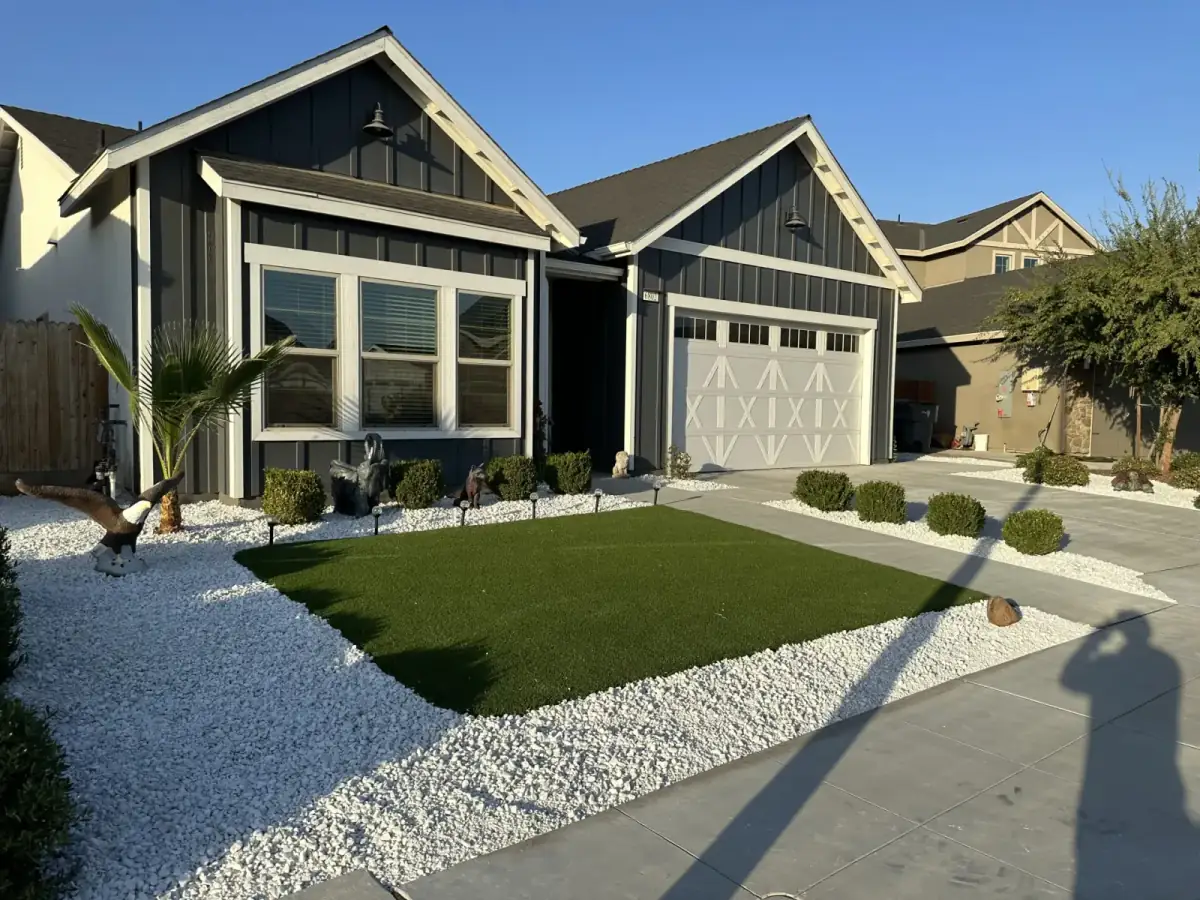 Modern home front yard with white rock and architectural plantings